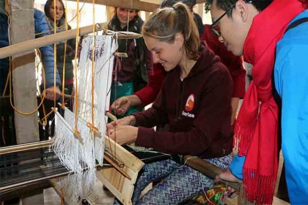 Thai Women at weaving loom
